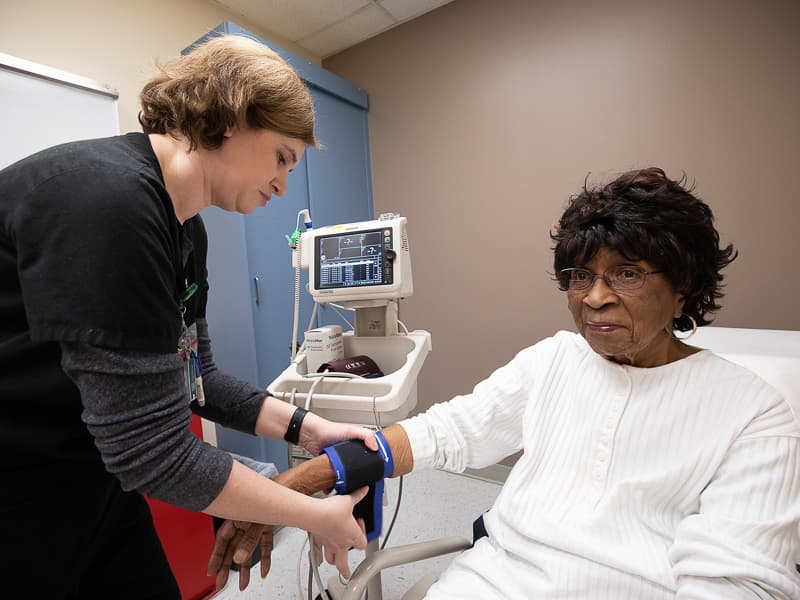 Recent research shows controlling blood pressure to a target of 120/80 mmHg may reduce the risk of mild cognitive impairment for older adults like Lillie Rose Hines of Braxton, pictured having her blood pressure measured by Pamela Burleson, UMMC nurse.