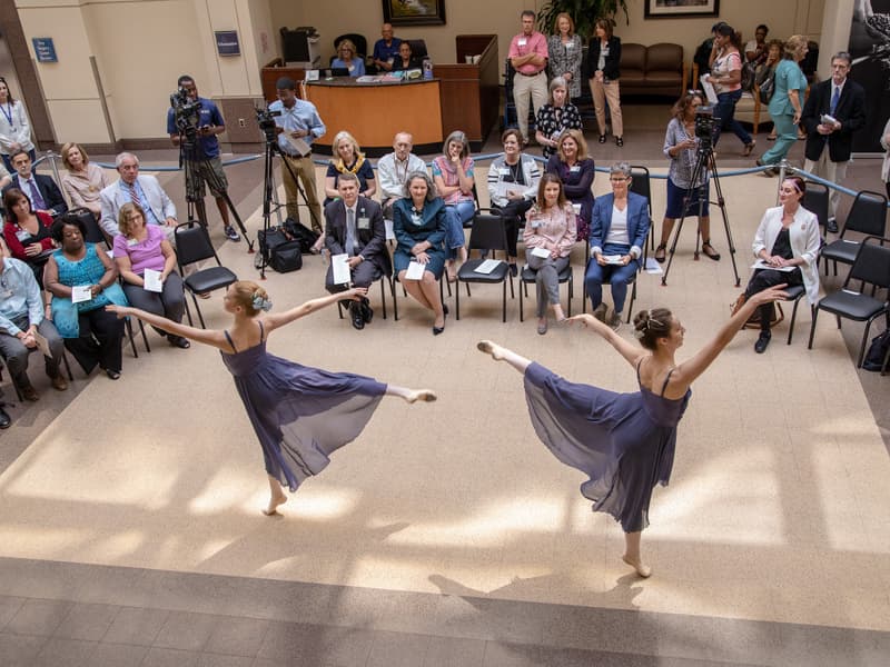 Dancers from Ballet Mississippi perform a selection for an audience of about 100 people gathered in the main lobby of the Medical Center.