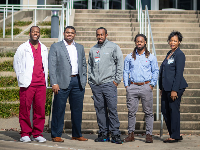 Former participants in the HELI program are still making their mark in health care at UMMC. Spending some time with their mentor, Dr. Juanyce Taylor, are, from left, Justin Johnson, a member of HELI’s third cohort; Will Lindsey, a member of HELI’s first cohort; Andre Funches, a member of HELI’s first cohort; and Geoffrey Pratt, a member of HELI’s third cohort.