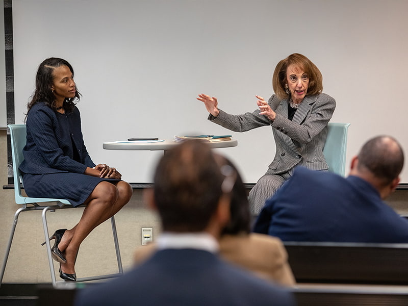 Heidi Margulis, right, Humana advisor and John D. Bower School of Population Health executive in residence, speaks at a fireside chat facilitated by Dr. Michelle Owens, UMMC professor of obstetrics and gynecology.