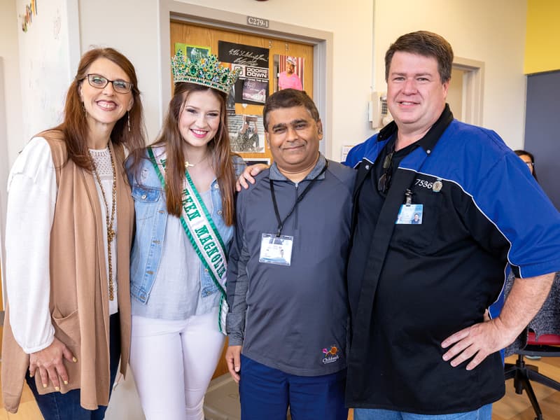 Dr. Abhay Bhatt, third from left, UMMC neonatologist, reunites with Savannah Richardson 18 years after the former patient left Batson Children’s Hospital. With them are Richardson’s parents, Jennifer and Bill.