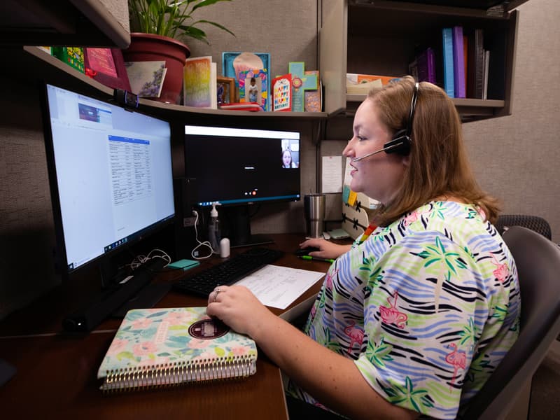 Courtney Sanders, nurse practitioner, visits via telehealth with a patient who lives with HIV.