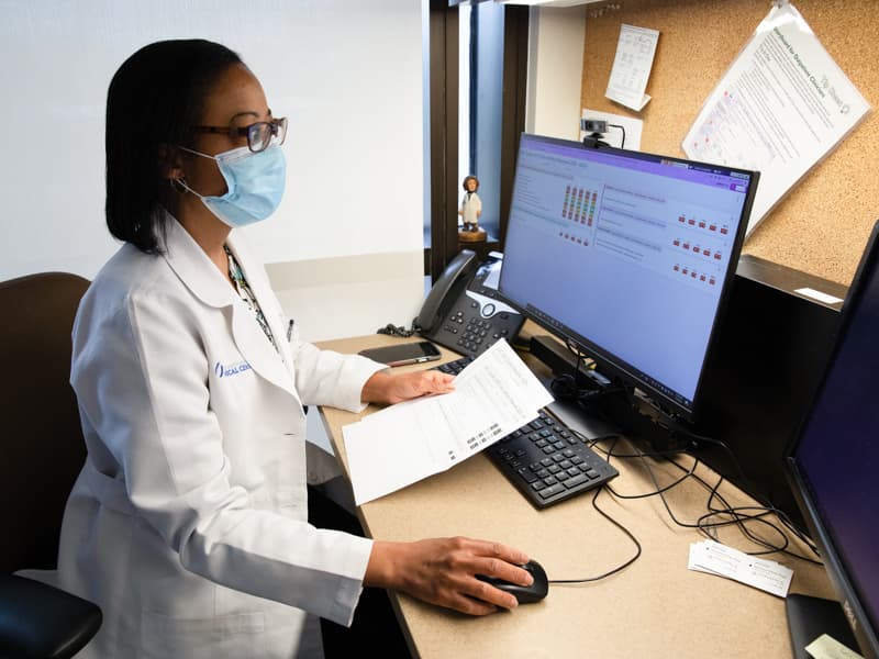 Dr. Kimberly Bibb, an assistant professor of family medicine, reviews a patient's electronic medical record using Healthy Planet.