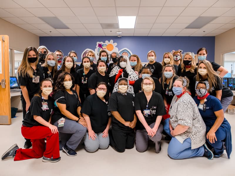 The NICU medical team and Dr. Mobolaji Famuyide, center, celebrated Halloween on Friday by wearing costumes with the theme of "101 Dalmatians." Their patients wore Dalmatian-spotted onesies and caps.