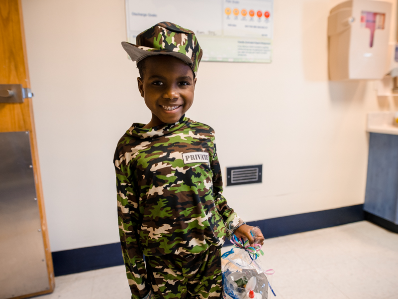 Children's of Mississippi patient Kaiyden Lynch of Jackson smiles in his Halloween costume Friday.