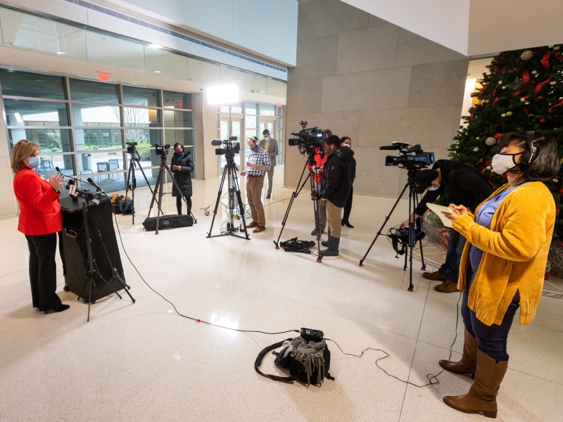 Dr. LouAnn Woodward, vice chancellor for health affairs and dean of the School of Medicine, speaks to media Wednesday about the start of vaccinations for UMMC employees at highest risk.