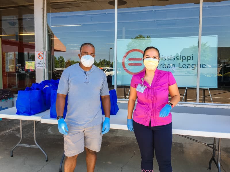 State Rep. Ronnie Crudup volunteers his time helping to distribute food from the EversCare food pantry. He's pictured with EversCare project manager Leslye Bastos Ortega.