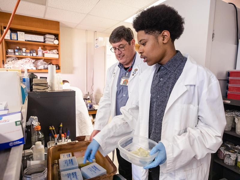 Stray has mentored dozens of Murrah High School students through Base Pair, including Kilando Chambers, now a Harvard University student, seen in this 2019 photo.