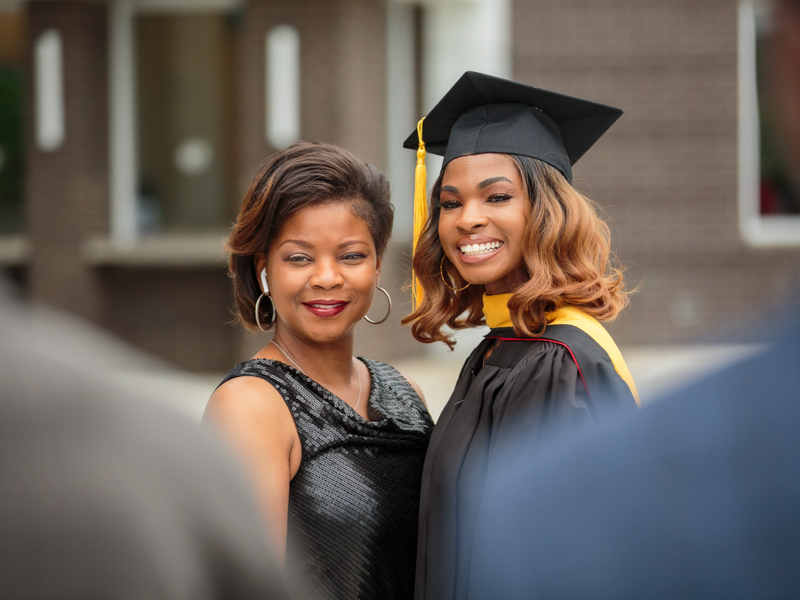 SGSHS Masters Candidate Jalah Carter, right, poses for a photo with her mother Gail Carter.