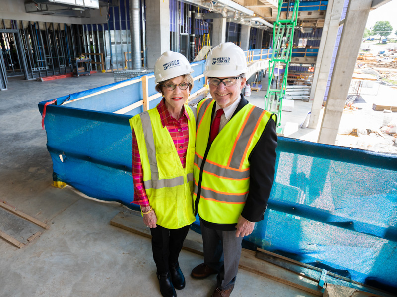 Kathy and Joe Sanderson are shown inside the Sanderson Tower during a tour of the construction site in 2019. 
