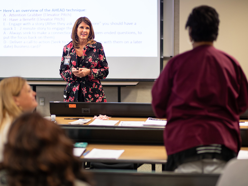 Class leader Dr. Elizabeth G. Franklin, center, an assistant professor of health administration, listens as Jessica Eglin, an administrative assistant in the Department of Pediatrics, shares her “elevator speech” with the Preparing for Success class.
