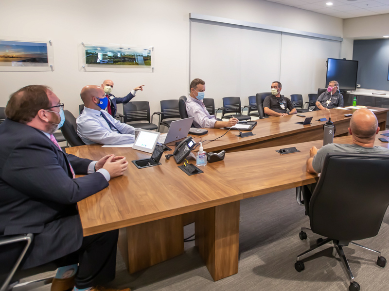 Dr. Jonathan Wilson, left, UMMC chief administrative officer, leads emergency medicine physicians and Mississippi Center for Emergency Services staff in a review of hurricane response procedures at MCES on the Medical Center campus.