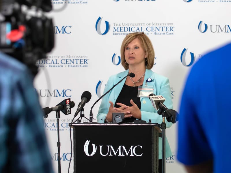 Dr. LouAnn Woodward, vice chancellor for health affairs and dean of the School of Medicine, details UMMC's COVID-19 patient load during a news conference Wednesday at the Medical Center.