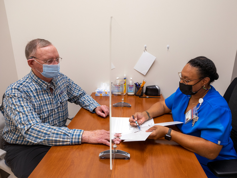 Samuel King of Madison prepares for his clinic visit with MIND Research Center employee Tamikia Washington. A new study from MIND Center scientists shows how blood tests in midlife may show who's most likely to experience healthy brain aging -- or cognitive decline -- later in life.
