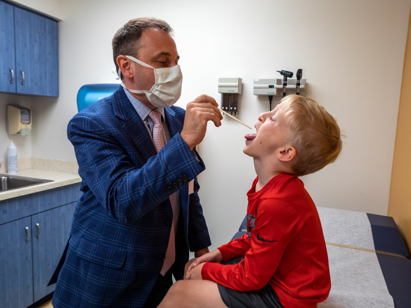 Dr. Ian Hoppe, Children's of Mississippi surgeon-in-chief and leader of the state's only ACPA-approved cleft team, takes a look at patient Cooper Beall of Vicksburg.