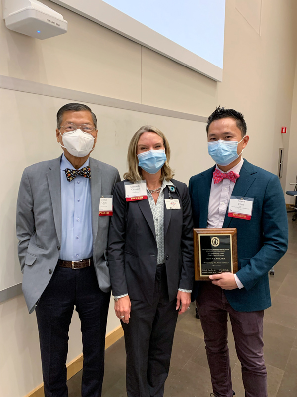 Dr. C.J. Chen, left, returned to campus in August 2021 for the UMMC Ophthalmology Update Conference. Chen asked his son, retinal specialist Dr. Royce Chen, right, to give the Dr. C.J. Chen Endowment Retinal Lecture at the meeting. They are pictured with Department of Ophthalmology chair Dr. Kimberly Crowder.