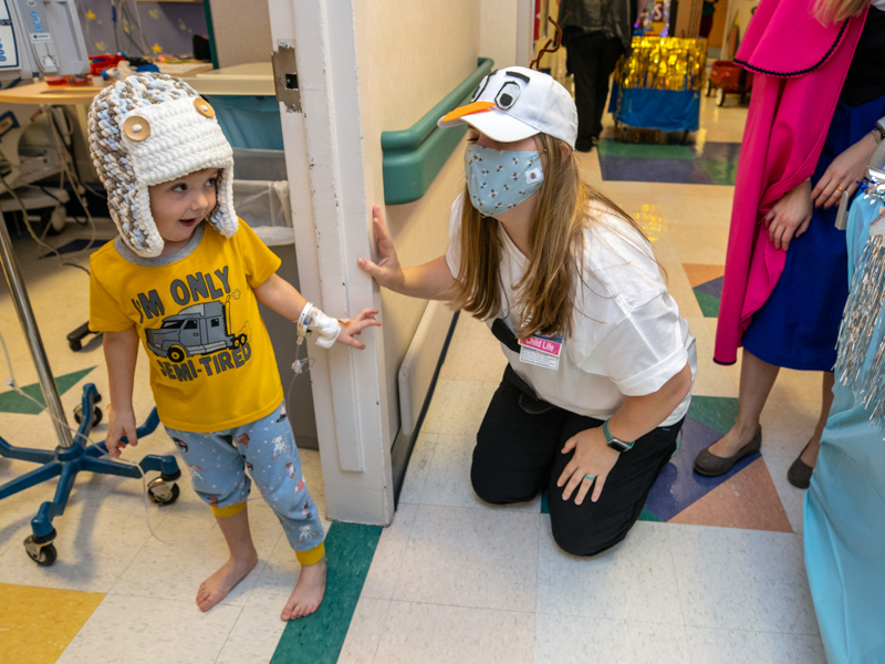 Children's of Mississippi patient Ford Wilson of Madison wears a wintry hat as he visits with "Olaf," aka child life specialist Courtney Easterday.