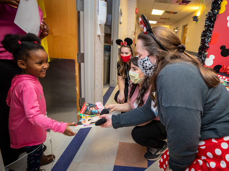 Children's of Mississippi patient Ji'Novah Canada of Jackson gets holiday surprises during the Children's of Mississippi Thanksgiving Parade Nov. 22.