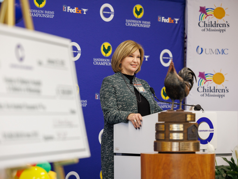 Dr. LouAnn Woodward, vice chancellor for health affairs and dean of the School of Medicine, praises the Sanderson Farms Championship for its commitment to children's health care in the state.