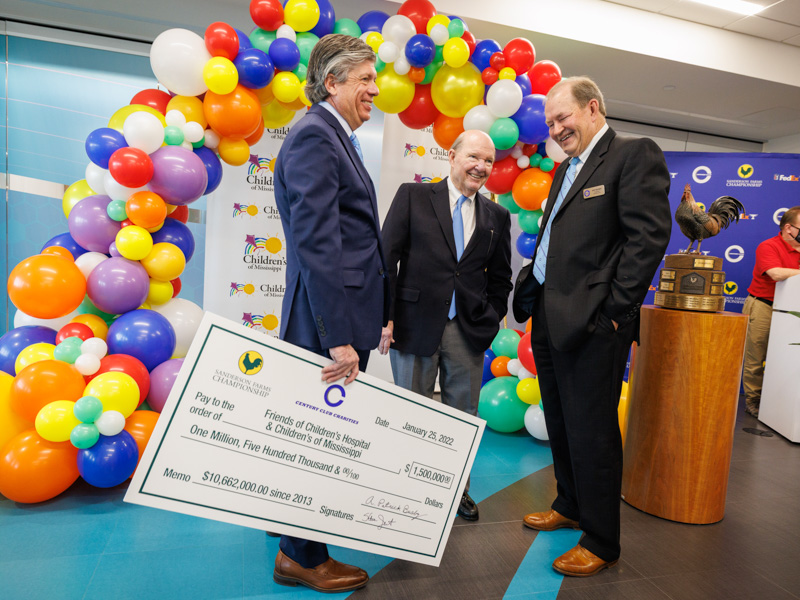 All smiles after announcing a $1.5 million donation from Century Club Charities are, from left, Sanderson Farms Championship executive director Steve Jent, Sanderson Farms CEO and board chairman Joe Sanderson Jr. and Pat Busby, president of Century Club Charities.