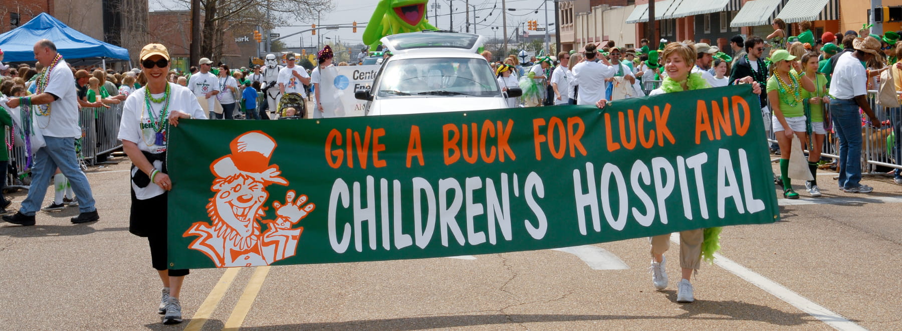 City sweep volunteers lead the Hal's St. Paddy's Parade in this 2009 file photo.