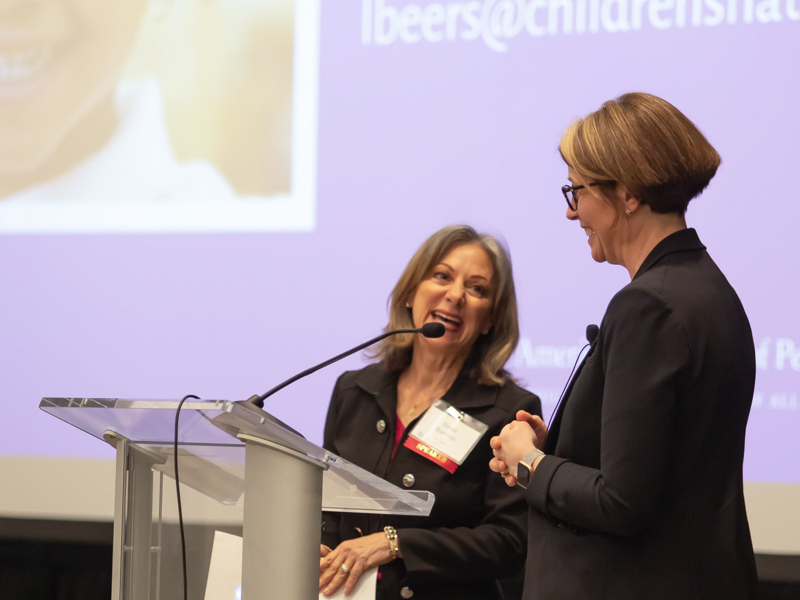 Dr. Susan Buttross, left, professor of pediatrics and principal investigator of the Mississippi Thrive! project at UMMC, thanks Dr. Lee Beers, immediate past president of the American Academy of Pediatrics, for speaking.