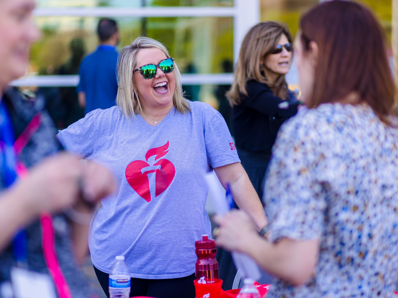 American Heart Association representative Whitney Morehead greeted UMMC employees and students during the campus National Walking Day celebration. Lindsay McMurtray/ UMMC Communications