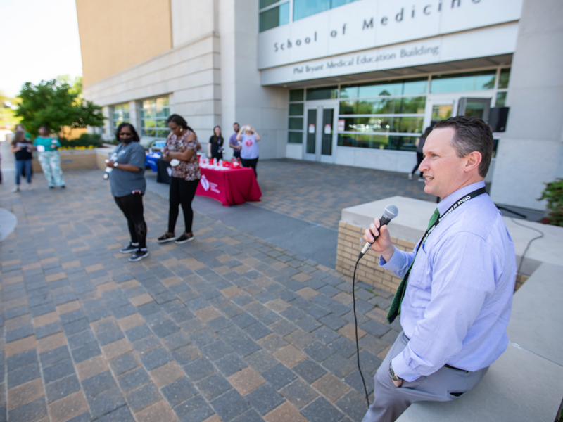 Dr. Josh Mann, chair of the Department of Preventive Medicine at UMMC, encourages National Walking Day participants to get their steps in. Melanie Thortis/ UMMC Communications
