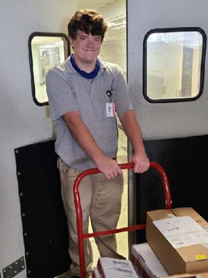 Coleman Canard helped transport supplies and equipment during his Project SEARCH rotation through shipping and receiving.