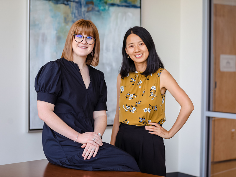 Rachel Tyrone, left, and Jenna Zhu are two of the School of Population Health's first PhD graduates. They studied how to improve the health of and health care for Mississippians through data and child development. Jay Ferchaud/ UMMC Communications