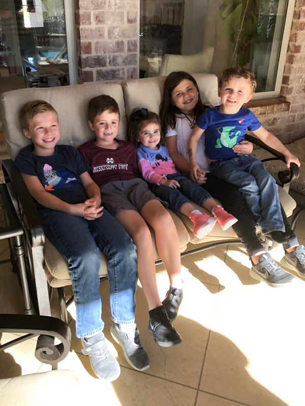 Easton, Turner, Liv, Addie and Landon – Dr. Bailey’s grandchildren – relax on their grandparents’ back porch. Her sixth grandchild, a boy named Campbell, was born May 24.
