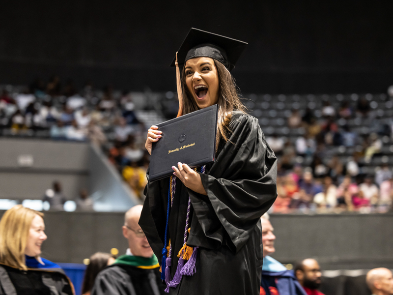 Madelynn Rhodes celebrates after accepting her Bachelor of Science in Nursing degree.