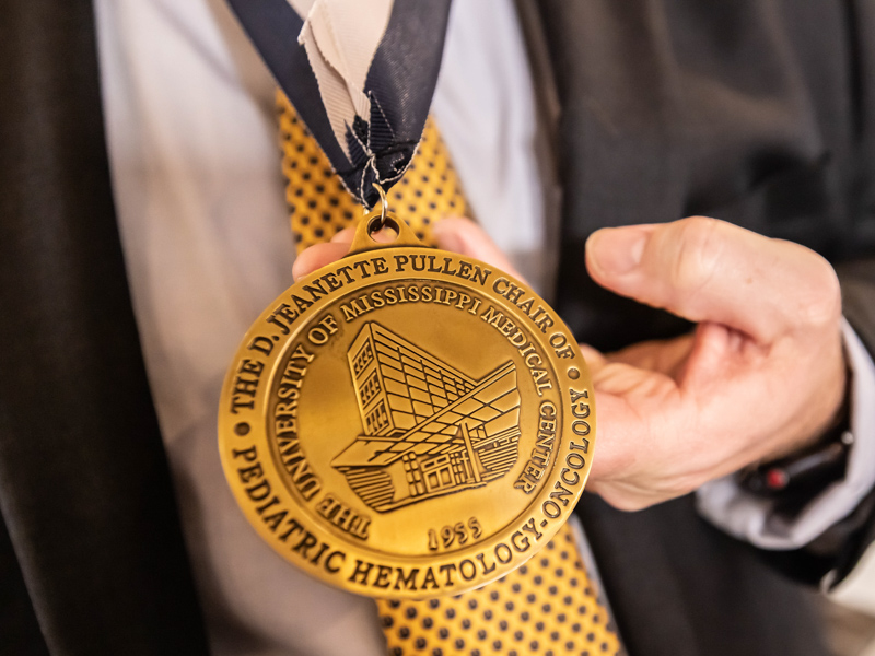 The D. Jeanette Pullen Chair of Pediatric Hematology-Oncology medal features an engraving of the Medical Center. Melanie Thortis/ UMMC Communications 