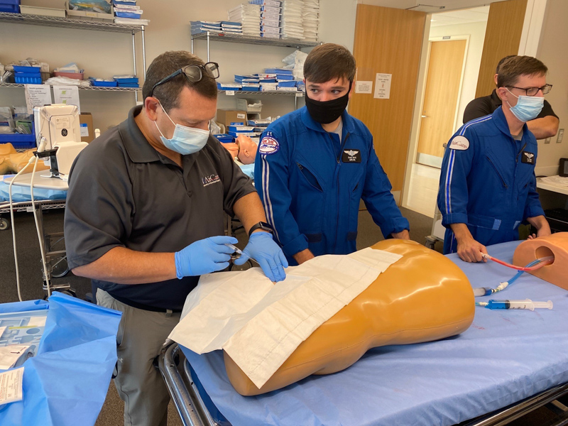 Sullivan gives simulation life-saving training on a mannequin to AirCare flight nurses Ken Smith and Kyle Ray.