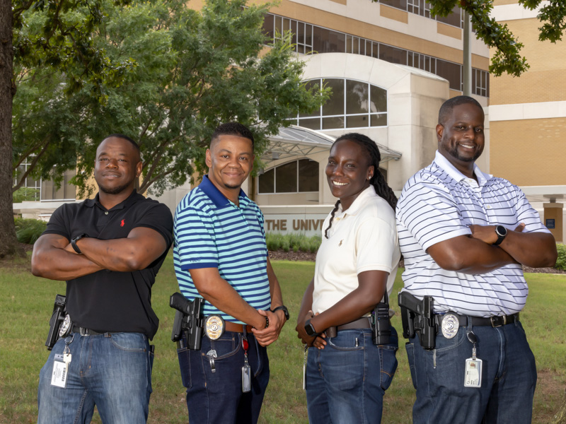 Officer Garry Lee, Sgt. Shaun Hiley, and Officers Shanice Mays and Sharkey Ford, assigned to the behavior response team, wear plain clothes when patrolling the hospital and responding to calls. Jay Ferchaud/ UMMC Communications