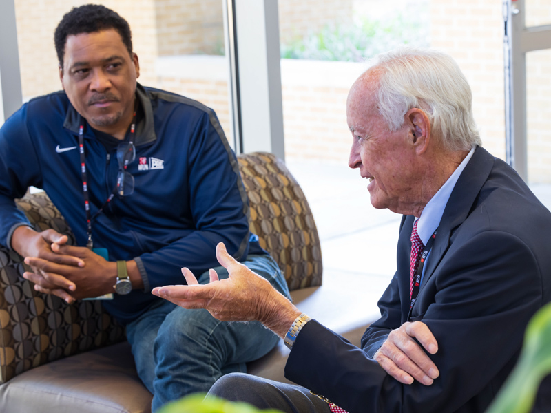 From left, Andre Collins, executive director of the Professional Athletes Foundation at the NFL Players Association, and Dr. Archie Roberts, creator and chairman of the Living Heart Foundation, chat during free health evaluations for former players Saturday at University Heart. Melanie Thortis/ UMMC Communications 