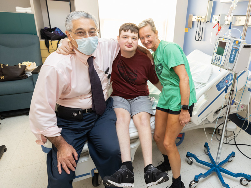 Dr. Makram Ebeid, director of pediatric interventional cardiology and the pediatric catheterization lab at UMMC, smiles with patient Cameron Kittrell and Cameron's mom Shannah of Pearl. Melanie Thortis/ UMMC Communications