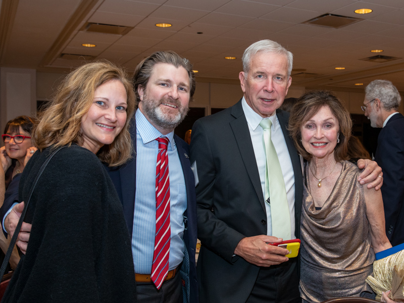 Voyles is congratulated for his Medical Alumni Chapter Hall of Fame induction by, from left, Susan Murphy and her husband, Dr. Jason Murphy ('03), who introduced Voyles during the ceremony as "my surgical father"; (Voyles); and Voyles' wife, Betty Ann Voyles.