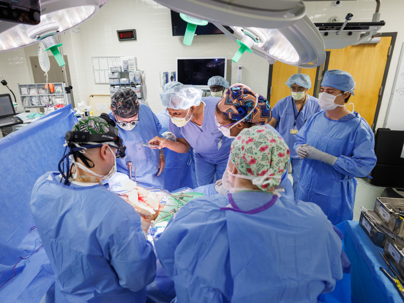 Dr. Vijay Vijayakumar, third from left, and Dr. Shannon Orr, second from left, and their team operate on one of the Medical Center's first abdominal intraoperative radiation therapy, or IORT, patients. Joe Ellis/ UMMC Communications 