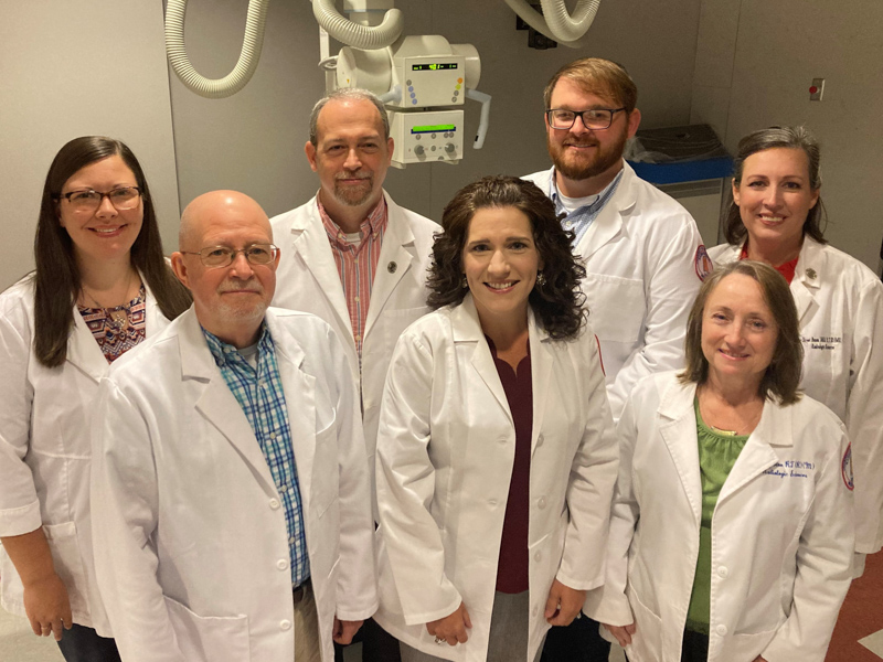 Dr. Kristi Moore, front row, second from left, with the Radiologic Sciences faculty, left to right: Dr. Mike Ketchum, Moore, Dr. Seena Shazowee Edgerton. Back row: Chelsea Stephens, Dr. Lee Brown, Zack Gray, Dr. Asher Street.