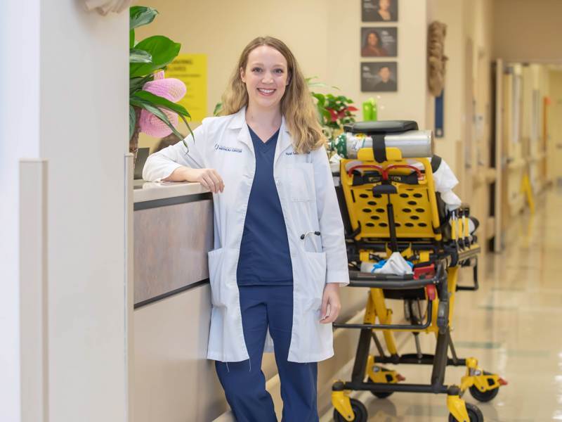 Nicki Lawson, shown here at the nurses’ station on the fourth floor of the Wiser Hospital for Women and Infants, is still working, PRN, as a nurse practitioner in hospital medicine while pursuing her medical degree. Melanie Thortis/ UMMC Communications