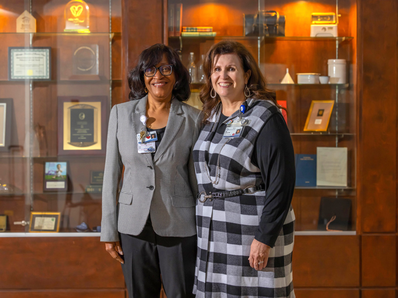 Dr. Kristina Cherry, chief nursing executive for the Health System, and Dr. Julie Sanford, dean of the School of Nursing, are working together toward excellence in nursing and nursing education.