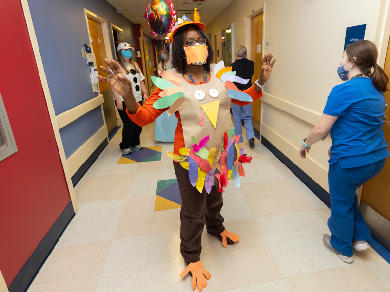 Child life assistant Michelle Chambers, dressed as a turkey, shared Thanksgiving greetings with Children's of Mississippi patients and their families. Melanie Thortis/ UMMC Communications 