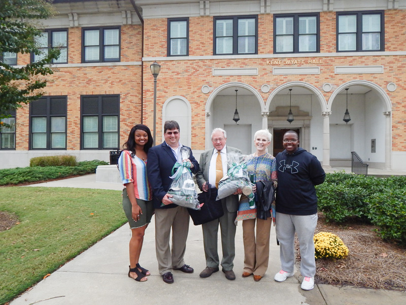 From left, Char Williams, Neal Holcomb, Dr. Robert L. Ellliott, Dr. Mary C. Elliott and Zack Odoms stand in front of Kent Wyatt Hall at Delta State University in 2016.