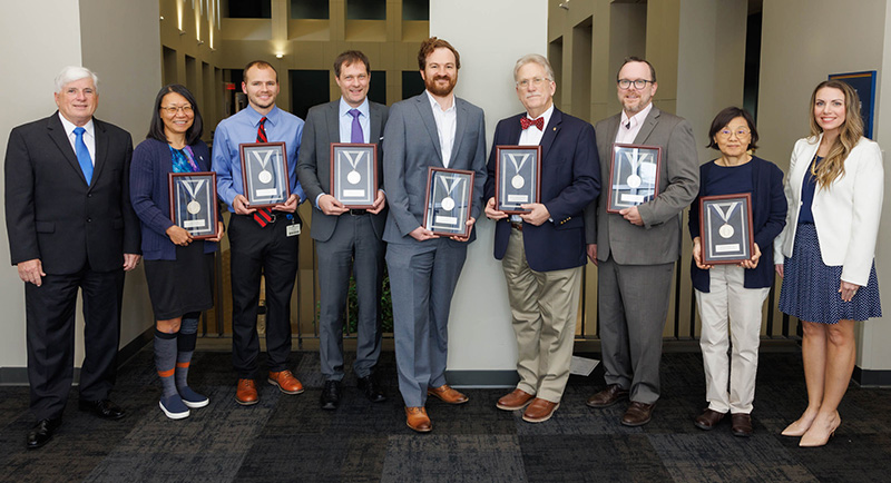 Silver award recipients, from second left to right, Dr. Nancy Min, Dr. Alan Mouton, Dr. Matthias Krenn, Dr. Eric Vallender, Dr. Gailen Marshall Jr., Chad Blackshear and Dr. Adrienne Tin. Not pictured is Dr. Harry Pantazopoulos.
