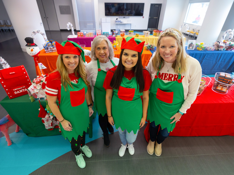 Santa's Workshop had helpers including, from left, Friends of Children's Hospital Community Relations and Special Events Manager Leslie Owens, Business Manager Teresa Matthews, Communications and Marketing Manager Mary Clair Kelly, and Jill Dale, a Friends of Children's Hospital board member. Melanie Thortis/ UMMC Communications 