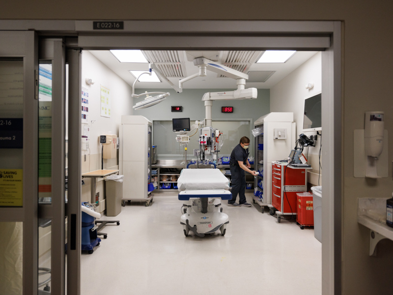 Registered nurse Adrian Davis tidies up a trauma room in the Adult Emergency Department at the University of Mississippi Medical Center.