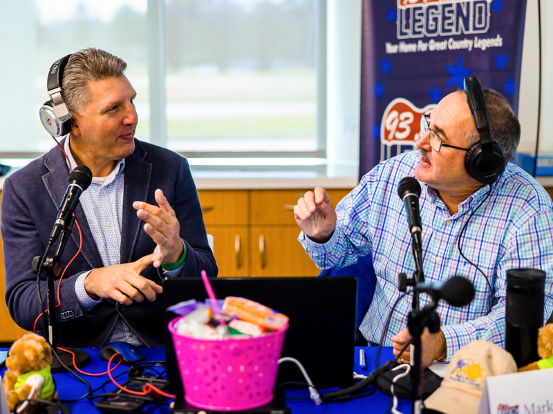 Scott Steele, left, and Mark McCoy, broadcasting for 93.5 The Legend, name the reasons for giving during the 2022 Mississippi Miracles Radiothon.