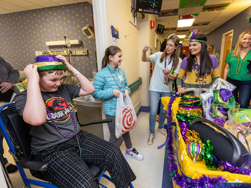 Children's of Mississippi patient Curtis "Austin" Barber and sister Caitlyn of Pineville, Louisiana, enjoy Mardi Gras with Friends of Children's Hospital Tuesday. Jay Ferchaud/ UMMC Communications 