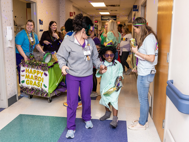 Children's of Mississippi patient Ayanna Adams of Jackson marches in the Friends of Children's Hospital Mardi Gras parade Tuesday. Jay Ferchaud/ UMMC Communications 
